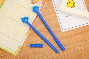 Detail view of cute blue whale gel pens with soft glue finish on a desktop