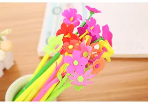 Close-up detail of colorful soft silicone flower toppers on creative cartoon gel pens