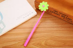 Close-up of cute cartoon flower gel pen with neon green soft rubber petal topper