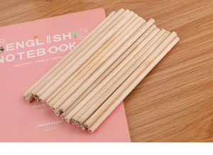 Macro detail of high-quality unsharpened natural wood HB pencils on a notebook