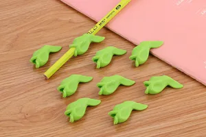 Detailed view of green fish-shaped silicone pencil grips for children stationery correction