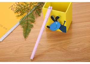 Detailed view of cute pink cartoon cat gel pen resting on a yellow desk organizer