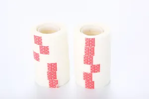 Detailed macro view of two stacks of white invisible adhesive tape rolls for DIY