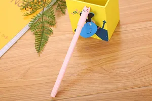 Detailed macro view of the cute pink gel pen featuring a cartoon cat-shaped cap design.
