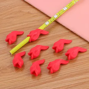 Cute red fish-shaped soft silicone pencil grips for kids ergonomic writing corrector.