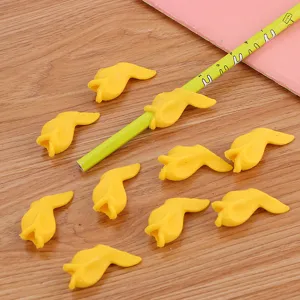 Set of cute yellow fish-shaped soft silicone pencil grips for kids handwriting correction