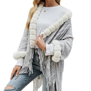 Elegant grey knit shawl with white faux fur trim and fringe detail for women's winter.
