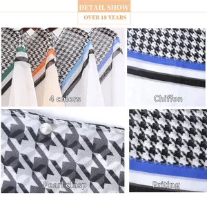 Macro view of houndstooth print and elegant pearl clasp on white chiffon sun protection shawl