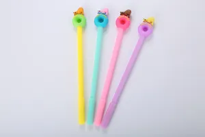 Macro detail of colorful donut gel pens featuring cute cartoon polar bear figurines