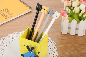 Cute cartoon cat gel pens set for school and office stationery macro detail view