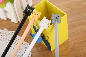 Detailed close-up showing cute cartoon cat-themed gel pens in four different stylish colors