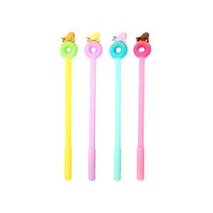 Set of four colorful cartoon gel pens with polar bear and donut toppers on white background