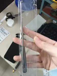Stainless steel fishing hook remover tool detail view for deep throat unhooking, portable gear.