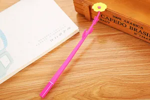 Close-up of a creative pink gel pen featuring a vibrant yellow soft rubber flower top.