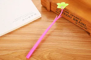 Detailed view of a creative pink flower gel pen with soft silicone texture on a desk