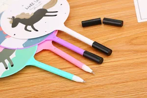 Macro detail of cute cartoon pony fan ballpoint pens with different colorful barrels