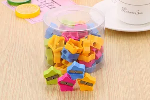 Collection of candy-colored star-shaped pencil sharpeners in a clear cylindrical jar