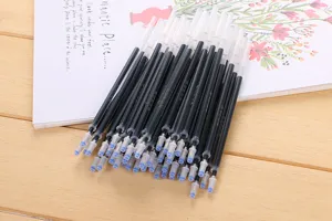 Macro shot of multiple black disappearing ink refills for calligraphy practice.