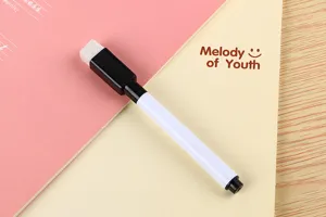 Close-up of a small erasable whiteboard pen with an eraser brush on the cap