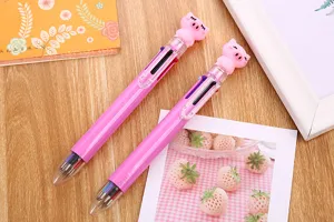 Detailed macro view of cute pink cartoon pig six-color ballpoint pens for stationery