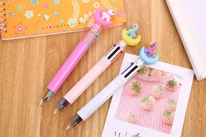 Detailed close-up view of 6-color ballpoint pens with cute unicorn moon toppers