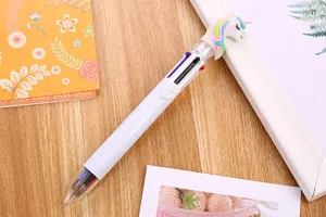 Close-up of a cute unicorn 6-color ballpoint pen with a decorative cartoon topper