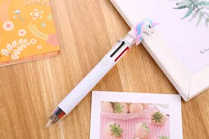 Close-up of cute unicorn multi-color ballpoint pen with 6 ink selectors