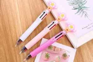 Detailed view of three 6-color ballpoint pens with cute cartoon magic wand toppers