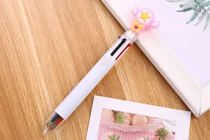 Detailed view of a multi-color cartoon ballpoint pen with star and wings design.