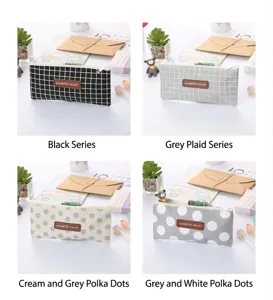 Collection of stylish Oxford cloth pencil cases featuring grid and polka dot patterns