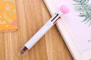 Close-up of a 6-color retractable ballpoint pen featuring a cute pink heart topper