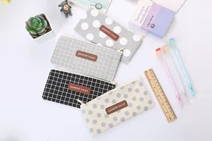 Set of four Oxford cloth pencil cases with stylish polka dot and grid patterns for students