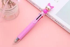 Detail view of a pink 6-color ballpoint pen featuring a cute cartoon character doll topper