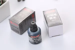 Detalle de la botella de tinta permanente negra de 12g y su caja de empaque S631