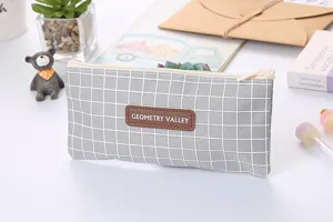 Close-up detail of Oxford fabric rectangular pencil case with minimalist gray grid pattern