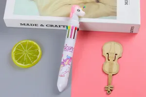 Close-up of 10-color retractable ballpoint pen with cute unicorn topper