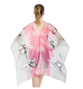 Detailed back view of a lightweight floral chiffon sun protection shawl with button accents