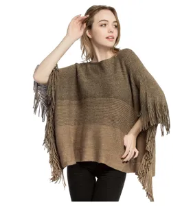 Close-up detail of metallic gold silk knit poncho with gradient and fringe trim