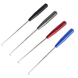 Stainless steel fishing hook remover detail showing extendable shaft and colorful handles.