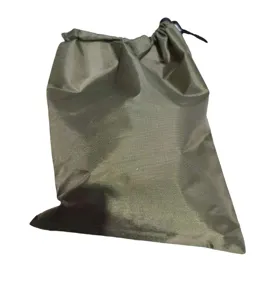Outdoor green nylon drawstring storage bag detail showing durable fabric and rope.