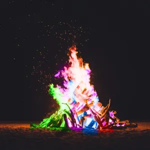 Magical color changing fire powder for camping bonfires, vibrant rainbow flames for outdoor parties.