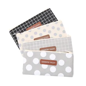 Set of four stylish Oxford cloth pencil cases featuring grid and polka dot patterns for students