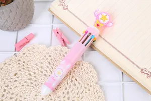 Detail view of 10-color pink ballpoint pen with winged star topper and Angel pattern