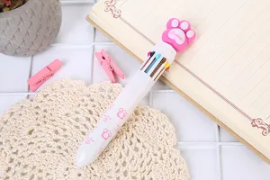 Close-up of cute pink cat paw topper on ten-color retractable ballpoint pen