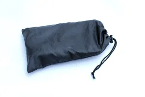 Outdoor folding chair replacement storage bag detail view, black portable drawstring pouch.