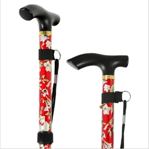 Detailansicht des Klapp-Trekkingstocks mit ergonomischem T-Griff, Blumenmuster und Handschlaufe.