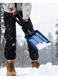 Detail shot of portable folding snow shovel with blue thickened plastic blade for winter.