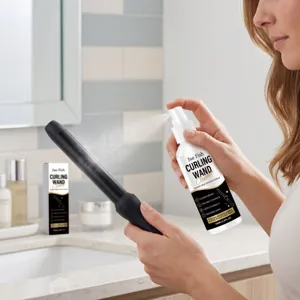 Detail view of hair styling tool cleaner spray cleaning black curling wand in bright bathroom.