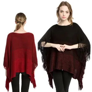 Oversized knit poncho shawl with metallic yarn and fringe details in gradient colors
