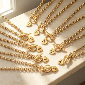 Gold tone letter heart pendant toggle clasp chain necklace detailed view showing alphabet options.